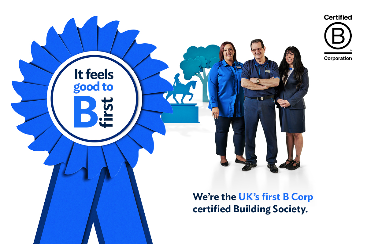 Coventry Building Society employees stood next to a Blue B Corp rosette