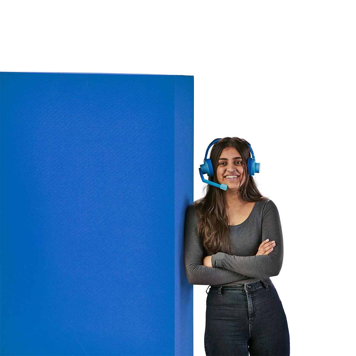 Illustration of a woman leaning on a blue block wearing headphones