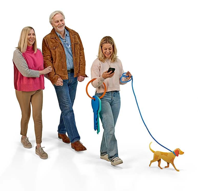 Woman walking a dog on a lead, holding her phone in the other hand. With her parents walking behind her 