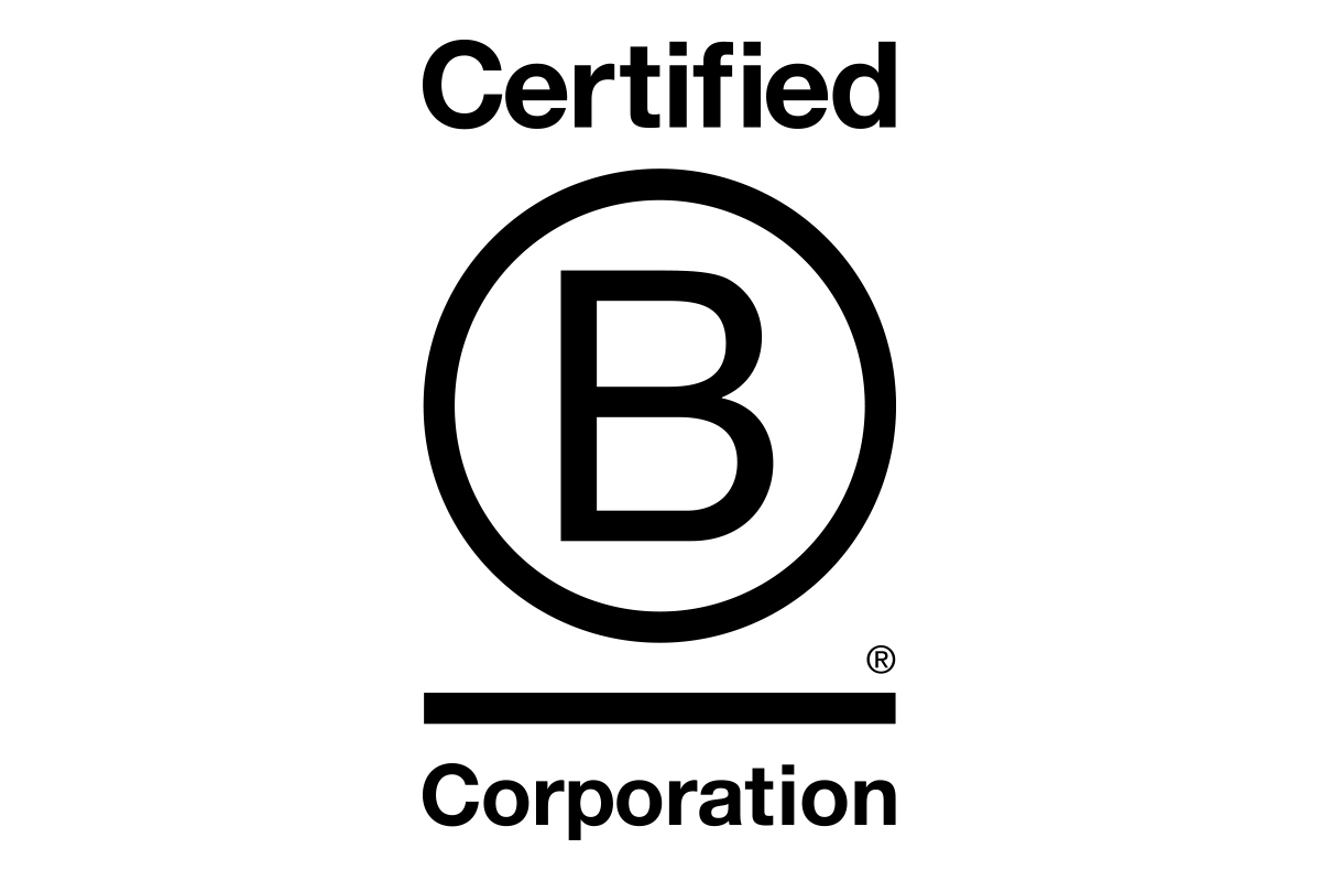 Coventry Building Society employees stood next to a Blue B Corp rosette